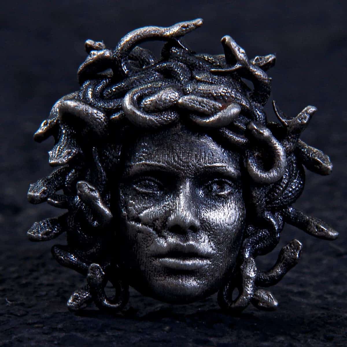 Medusa Earring, Crafted from solid sterling silver, this striking stud showcases the fierce face of Medusa crowned with venomous serpents.