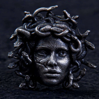  Medusa Earring, Crafted from solid sterling silver, this striking stud showcases the fierce face of Medusa crowned with venomous serpents.
