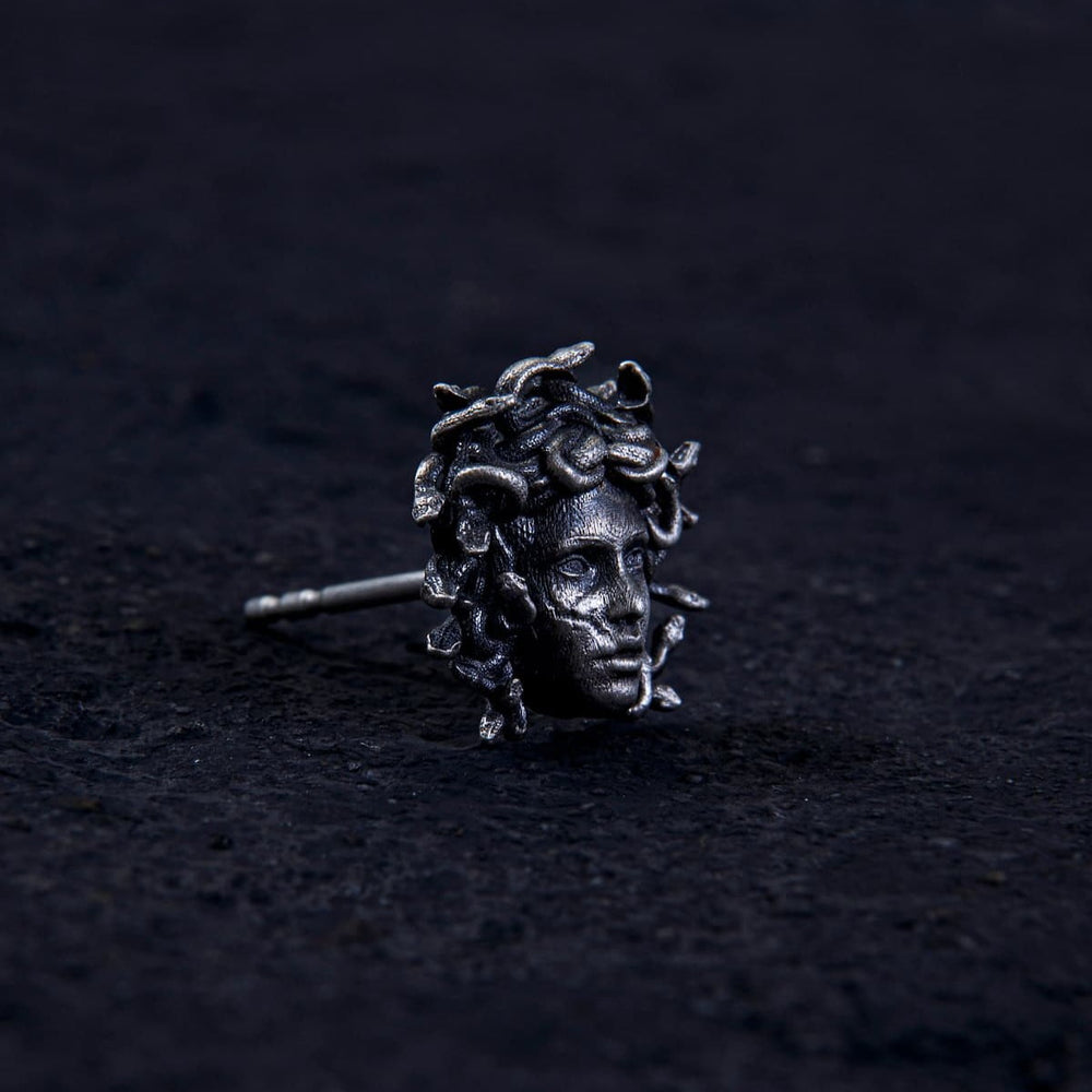 Unleash ancient power with the Gordon Medusa Earring. Crafted from solid sterling silver, this striking stud showcases the fierce face of Medusa crowned with venomous serpents.