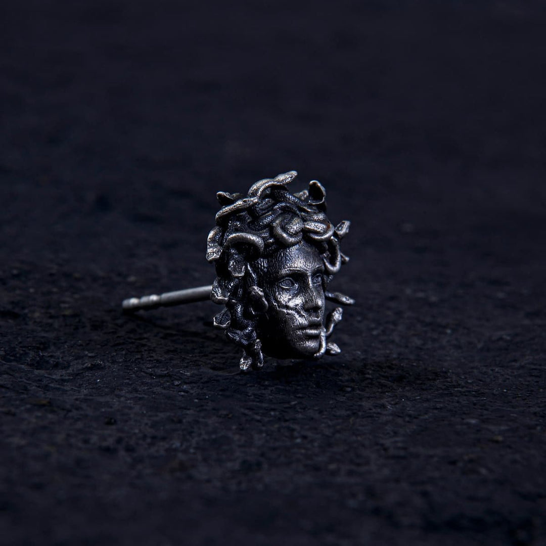 Unleash ancient power with the Gordon Medusa Earring. Crafted from solid sterling silver, this striking stud showcases the fierce face of Medusa crowned with venomous serpents.