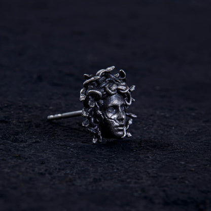 Unleash ancient power with the Gordon Medusa Earring. Crafted from solid sterling silver, this striking stud showcases the fierce face of Medusa crowned with venomous serpents.