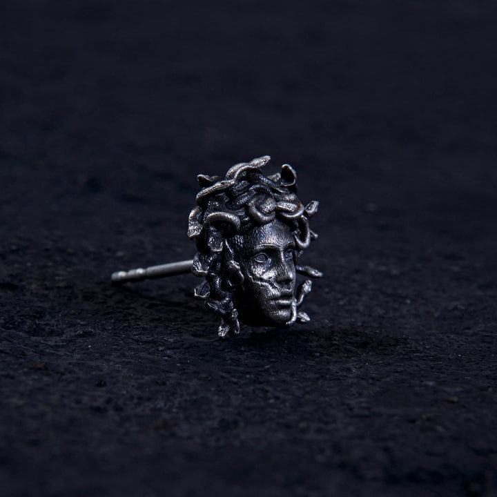 Unleash ancient power with the Gordon Medusa Earring. Crafted from solid sterling silver, this striking stud showcases the fierce face of Medusa crowned with venomous serpents.