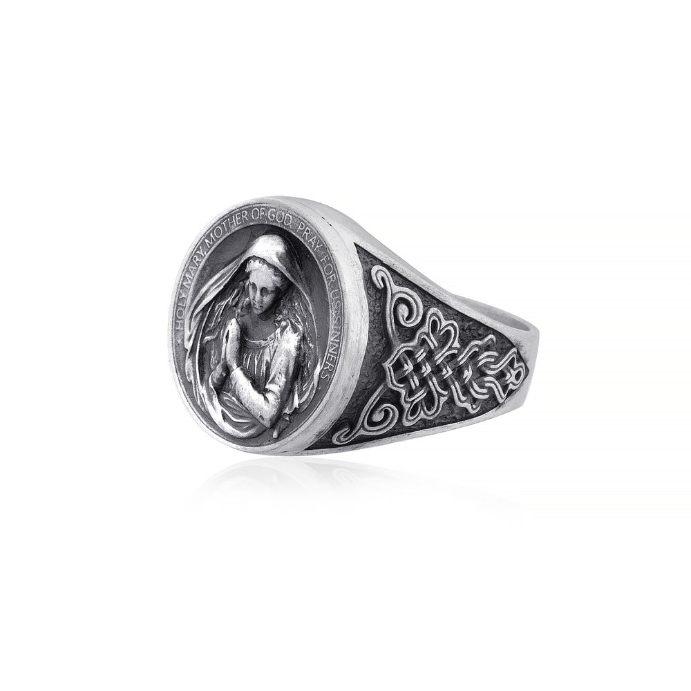 Sterling silver Virgin Mary Ring showcasing intricately engraved Mary with folded hands and the prayer 'Holy Mary, Mother of God, Pray for us sinners' encircling the design.