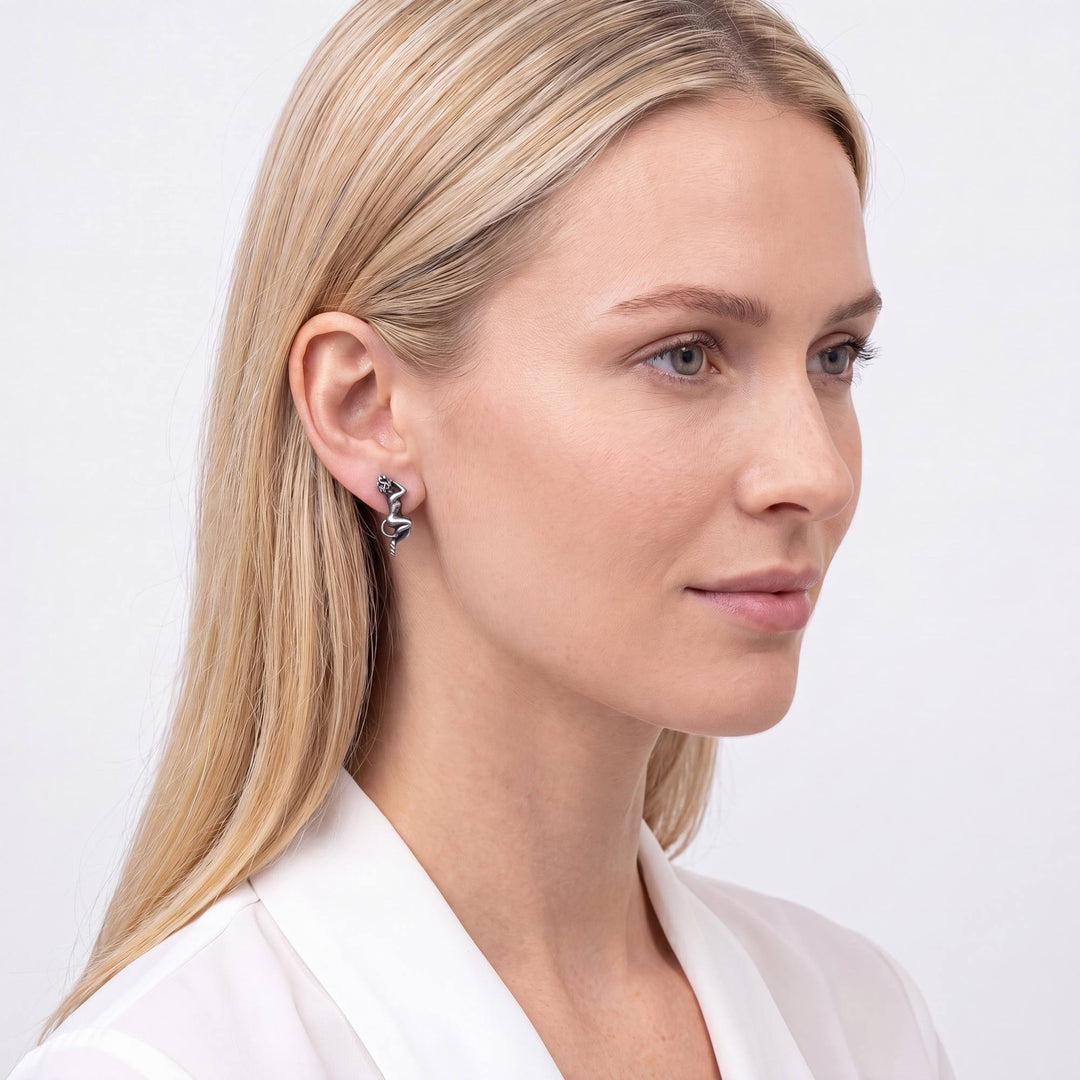 Angel and Devil Whispering Earrings worn by model, oxidized 925 silver devil earring