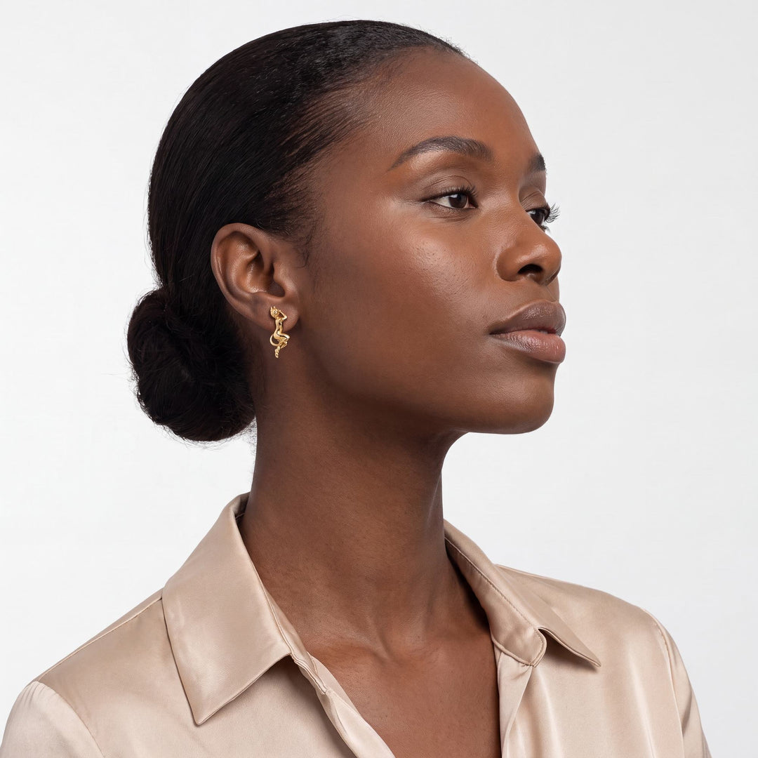 Angel and Devil Whispering Earrings worn by model, gold plated devil earring