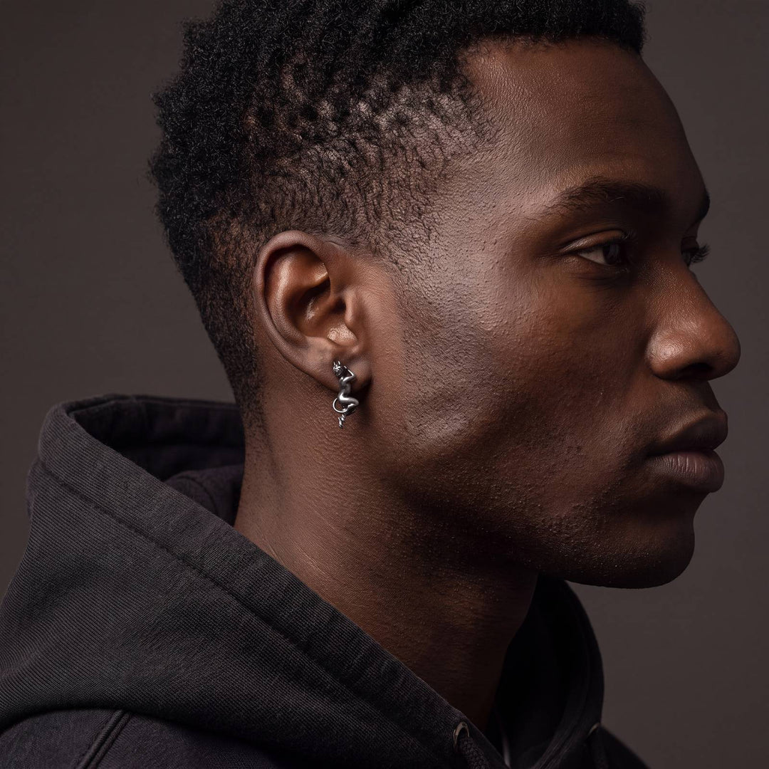 Angel and Devil Whispering Earrings worn by male model, oxidized 925 silver devil earring
