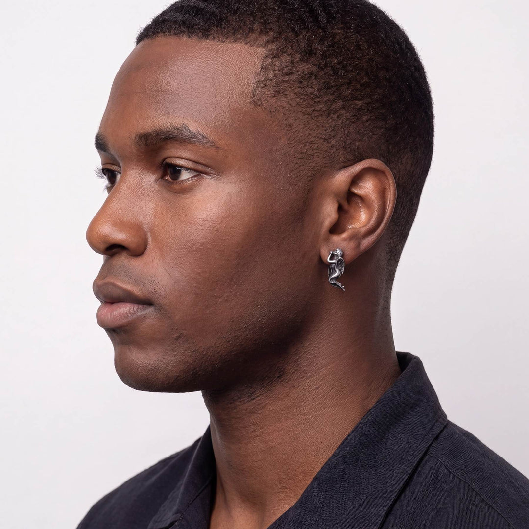Angel and Devil Whispering Earrings worn by male model, oxidized 925 silver angel earring