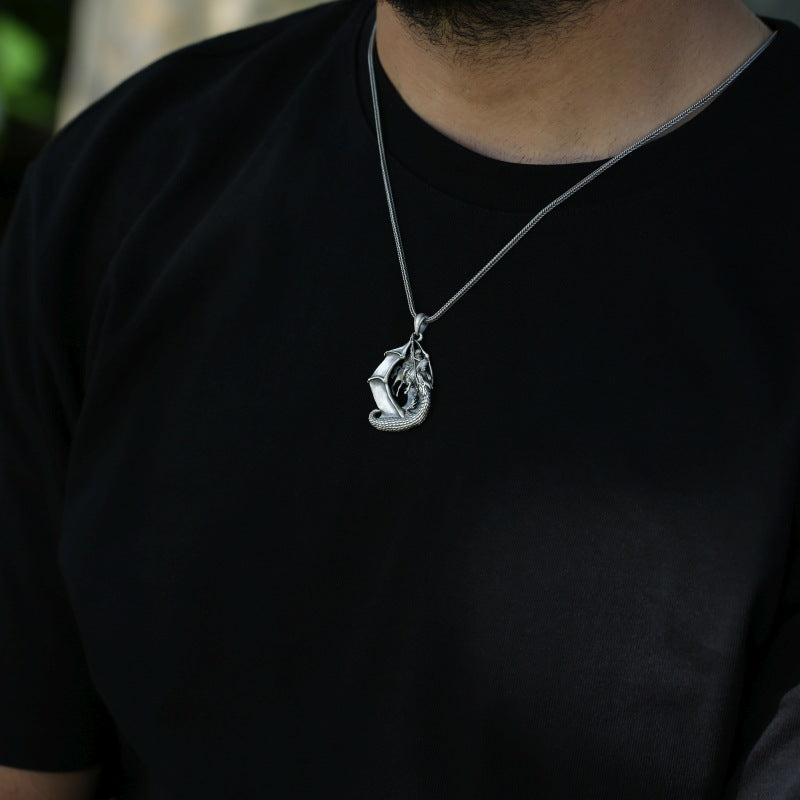 dragon slayer pendant on the neck