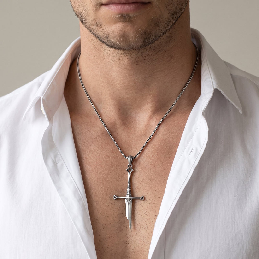 Man wearing the oxidized silver Elven Sword pendant necklace, open white shirt