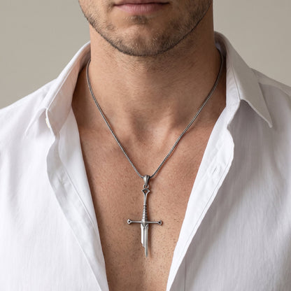 Man wearing the oxidized silver Elven Sword pendant necklace, open white shirt