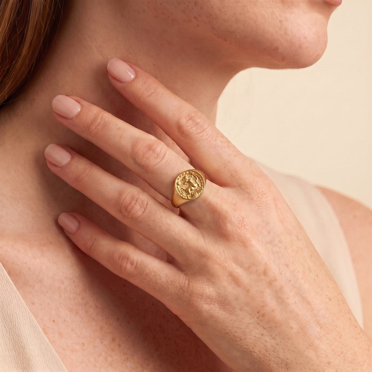 Sagittarius Zodiac Ring on female model — gold plated