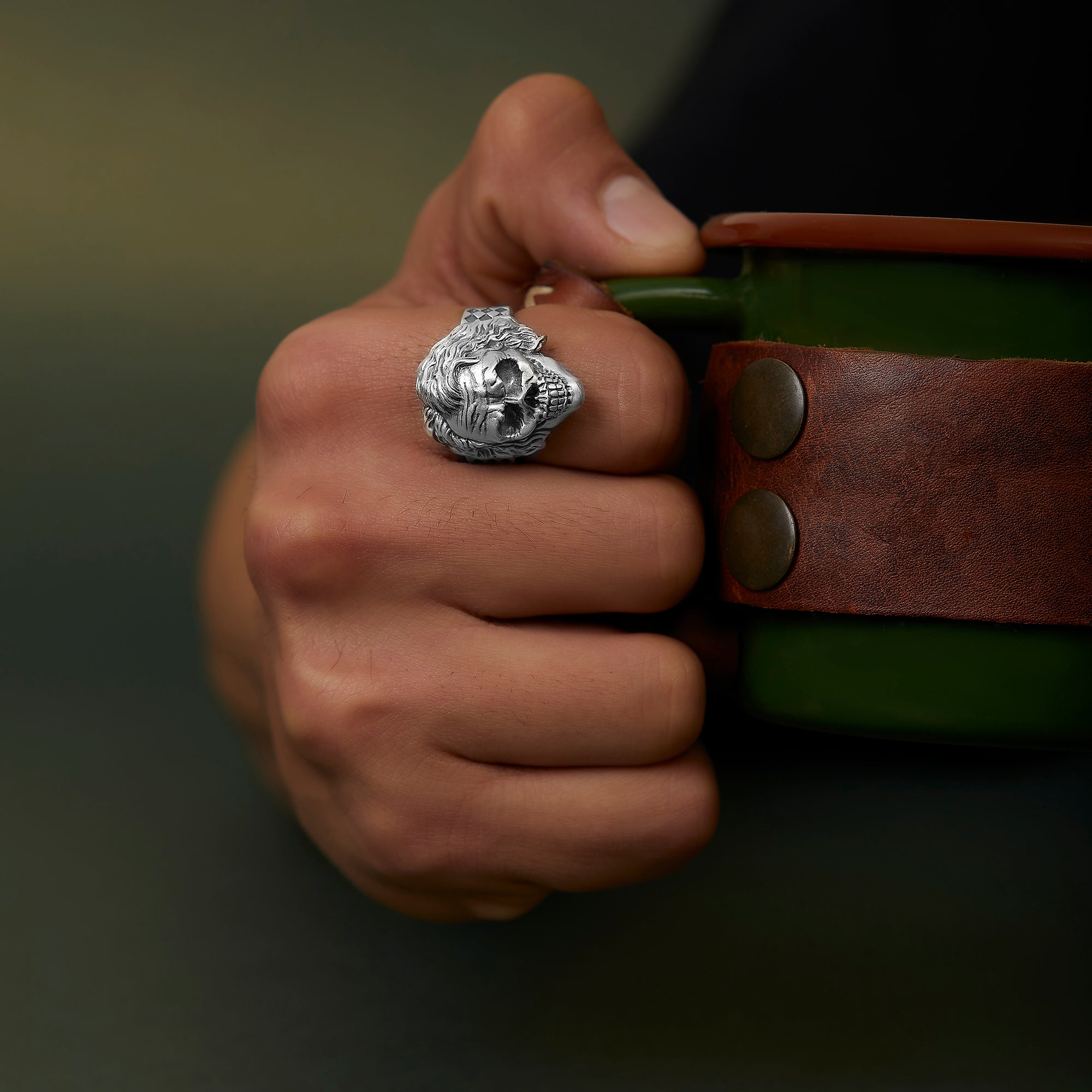 handmade sterling silver Joker Skull Ring on the hand preview