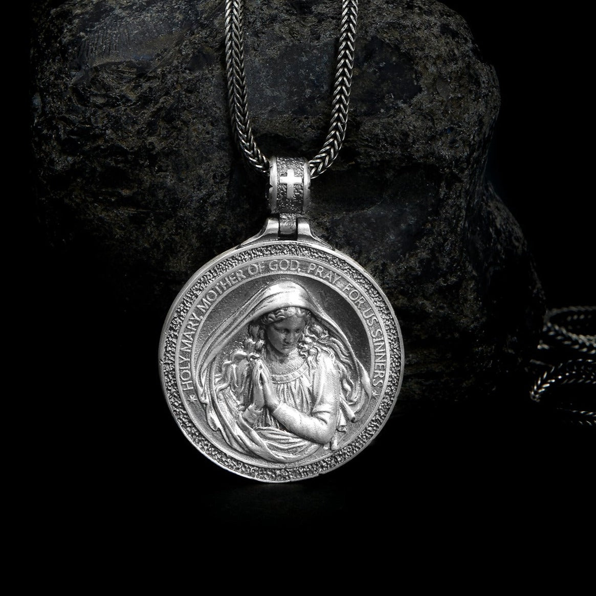 Sterling silver Holy Mary Necklace featuring an intricately carved Mother Mary with folded hands and detailed hair strands, representing faith and devotion