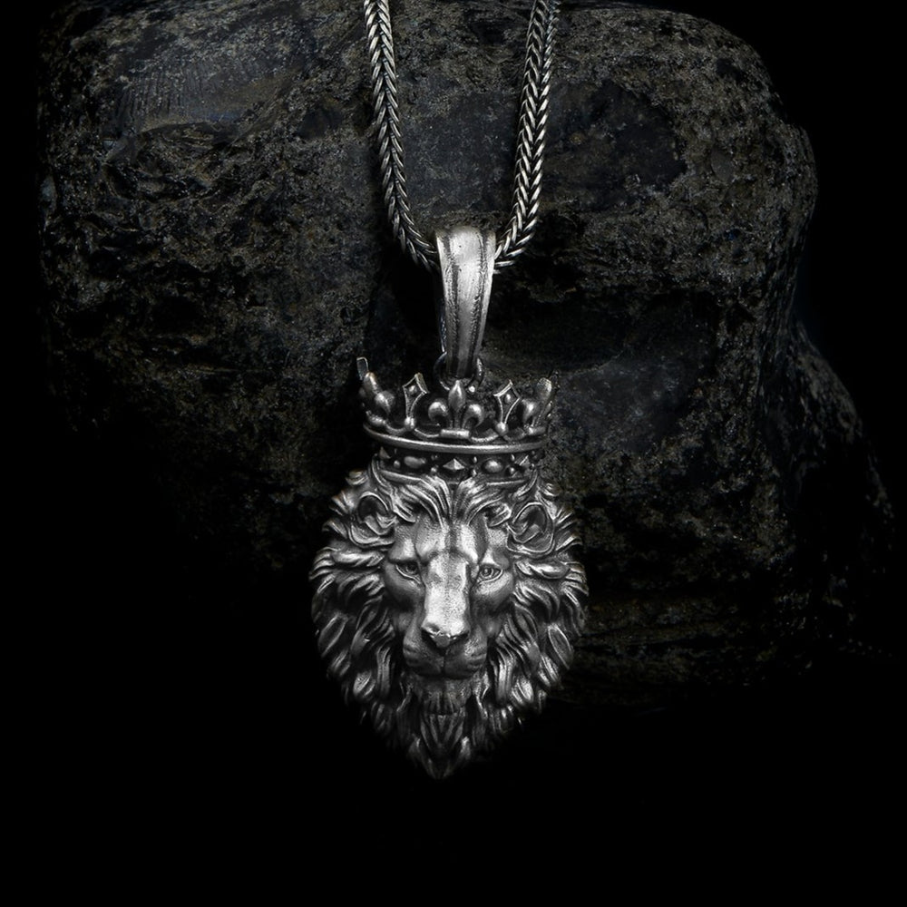  sterling silver lion necklace showcasing a finely detailed lion's face crowned with a regal tiara, encapsulating strength and royalty in one design.