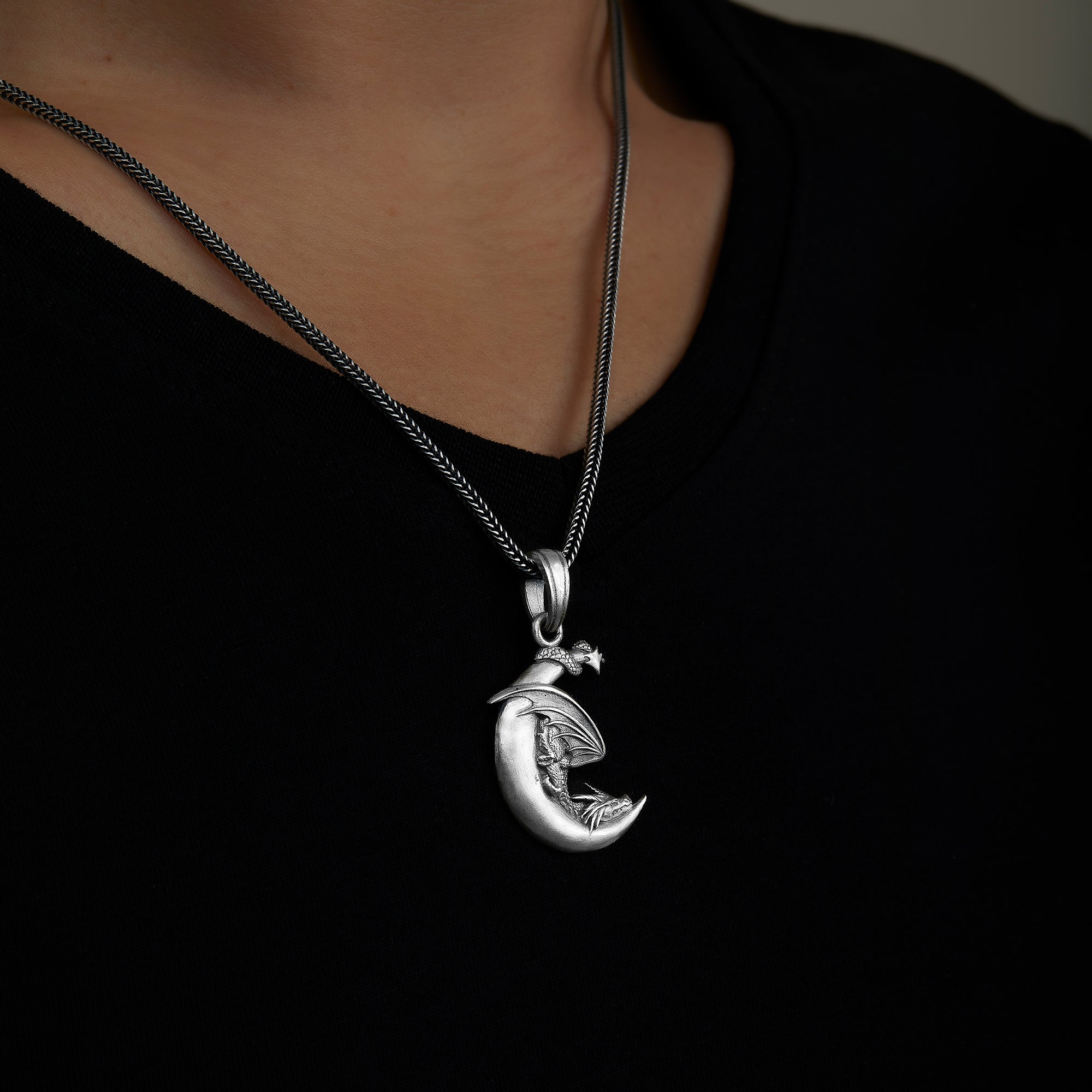 handmade sterling silver Moon Dragon Necklace on the  neck