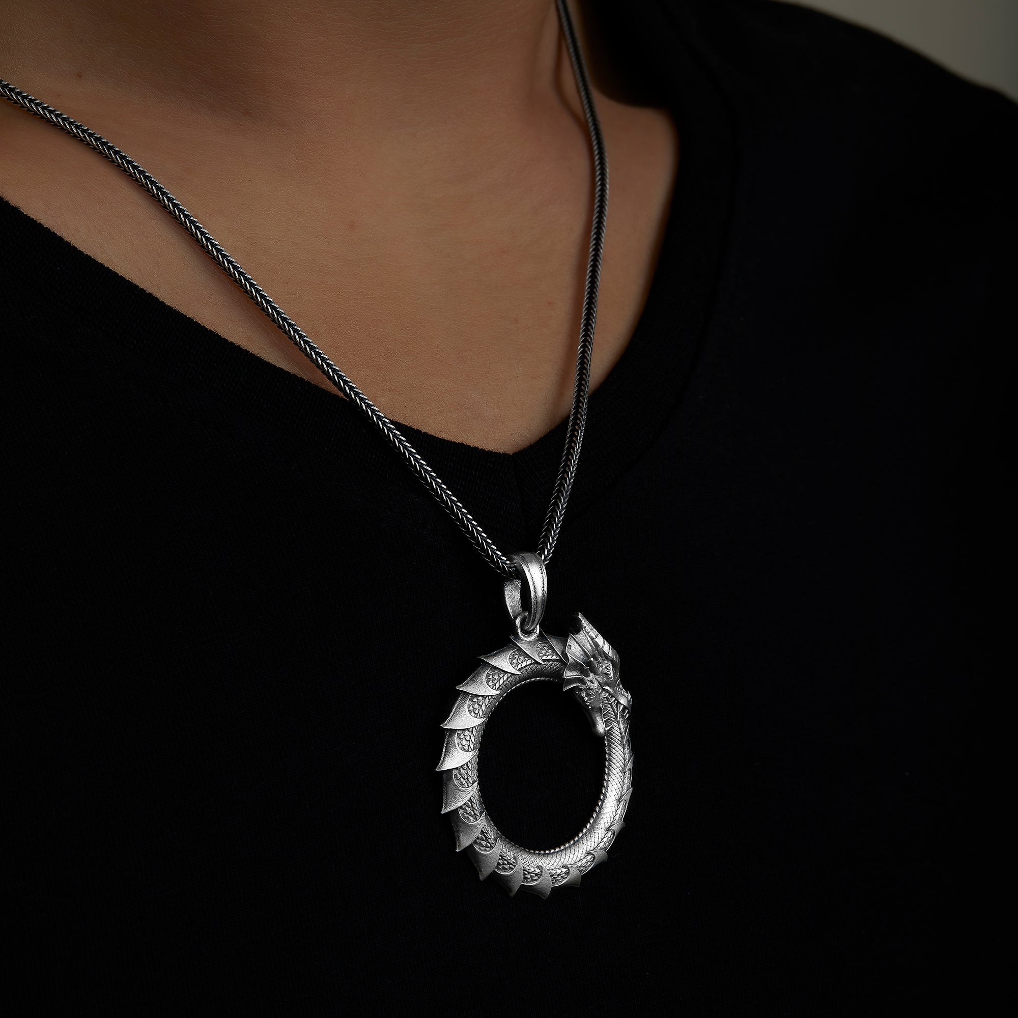 handmade sterling silver Ouroboros Necklace on the neck preview