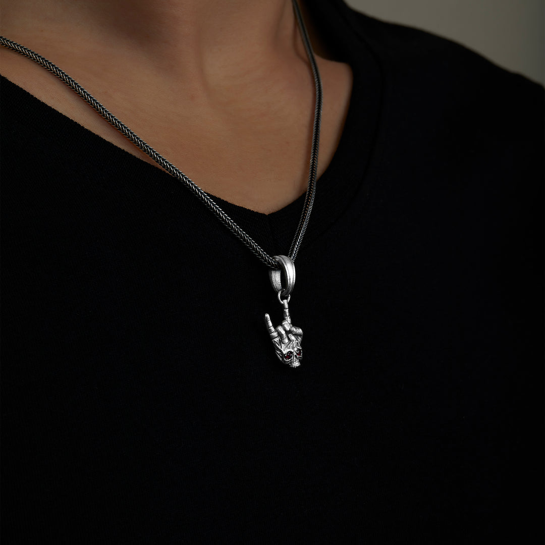 handmade sterling silver Rock Skull Necklace on the neck preview