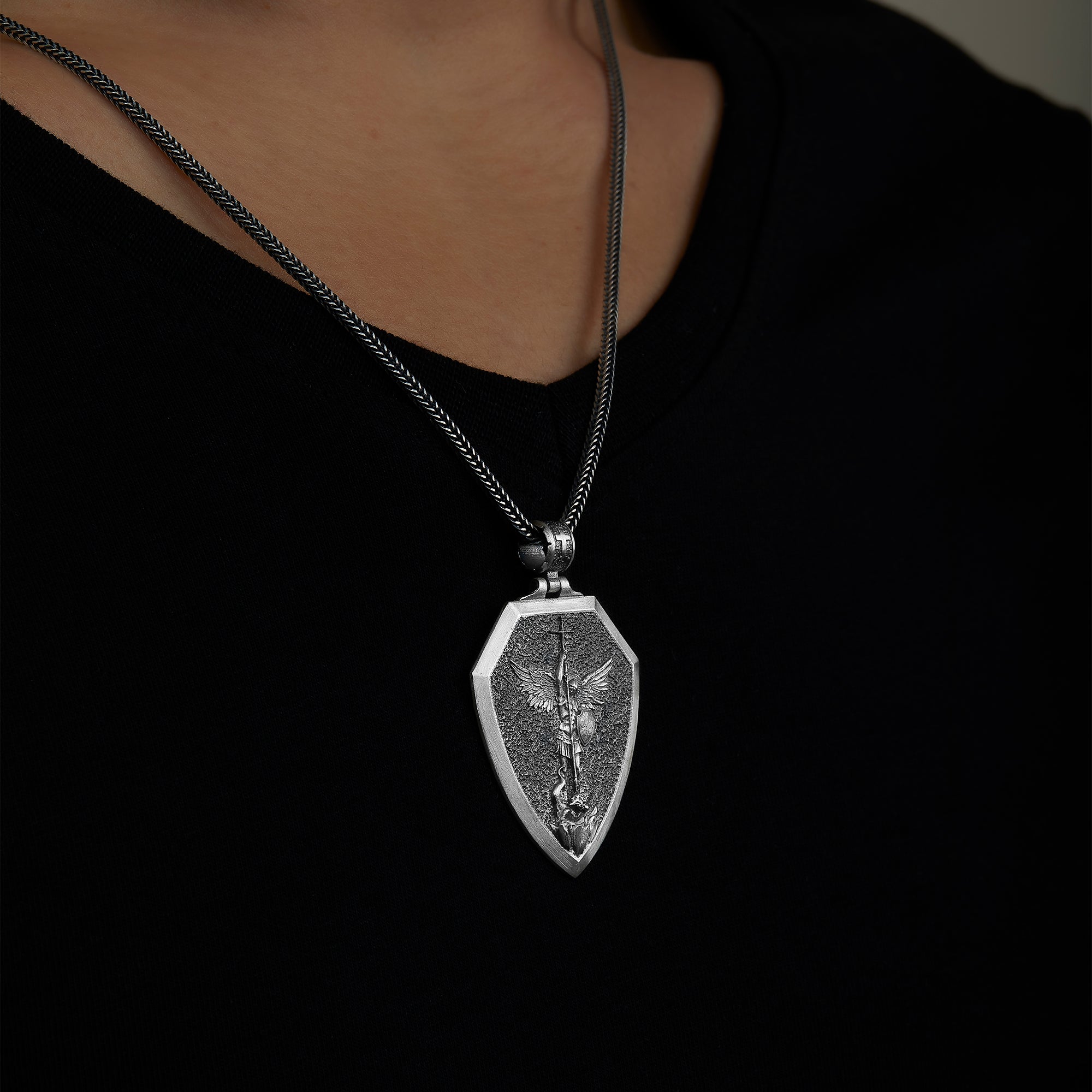handmade sterling silver Saint Michael Archangel Necklace on the neck preview