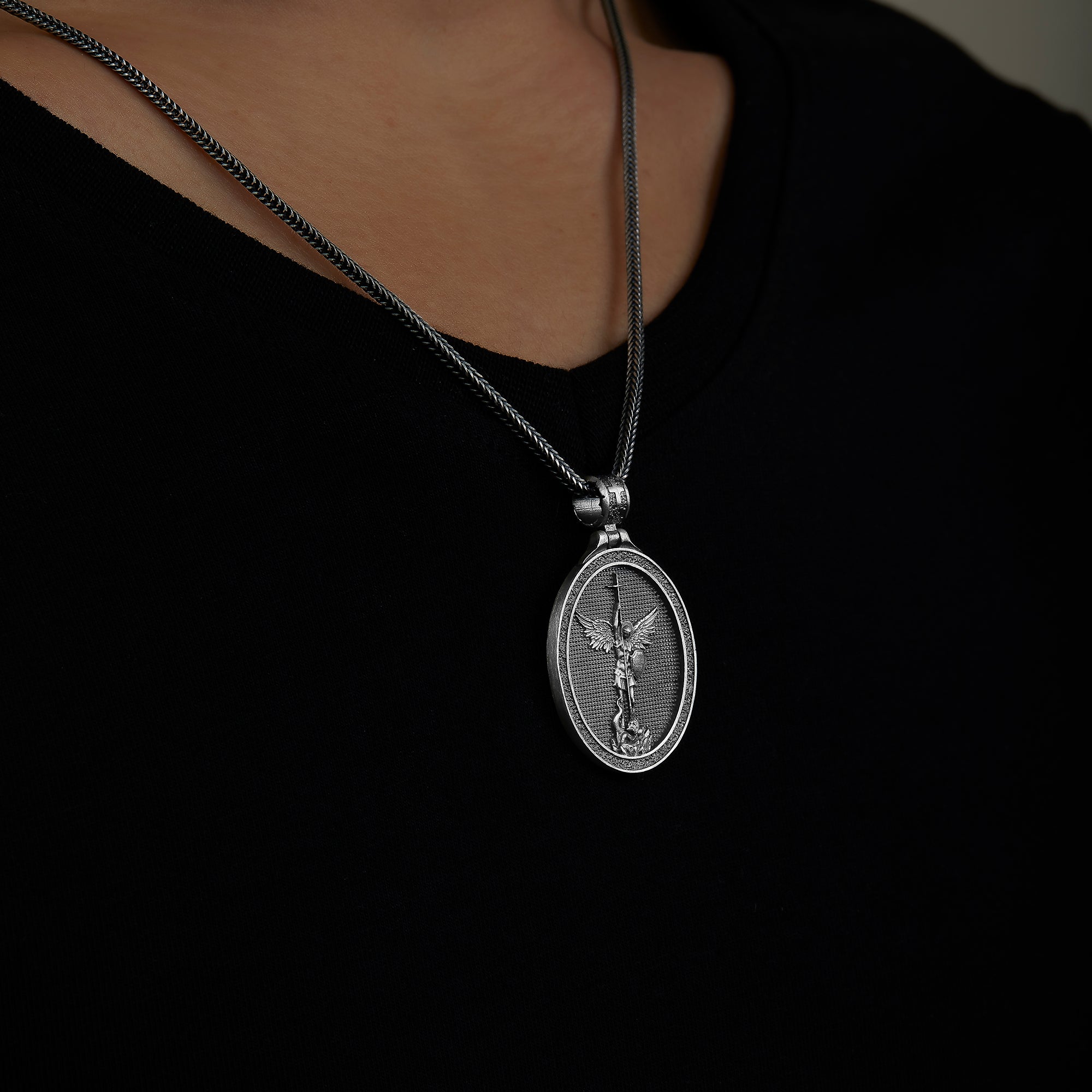 handmade sterling silver Saint Michael Necklace on the neck preview