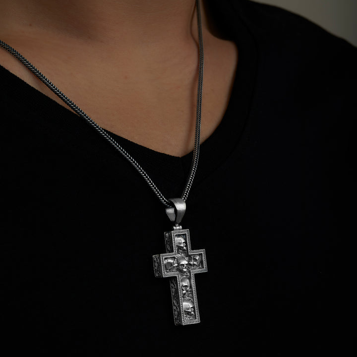 handmade sterling silver Skulls In Cross Necklace on the neck preview