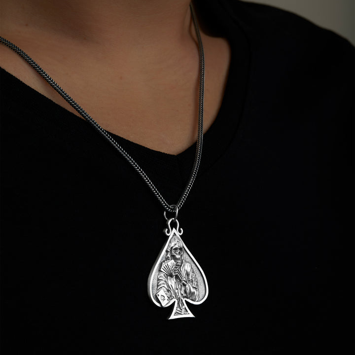 handmade sterling silver Spade Skull Necklace on the neck preview