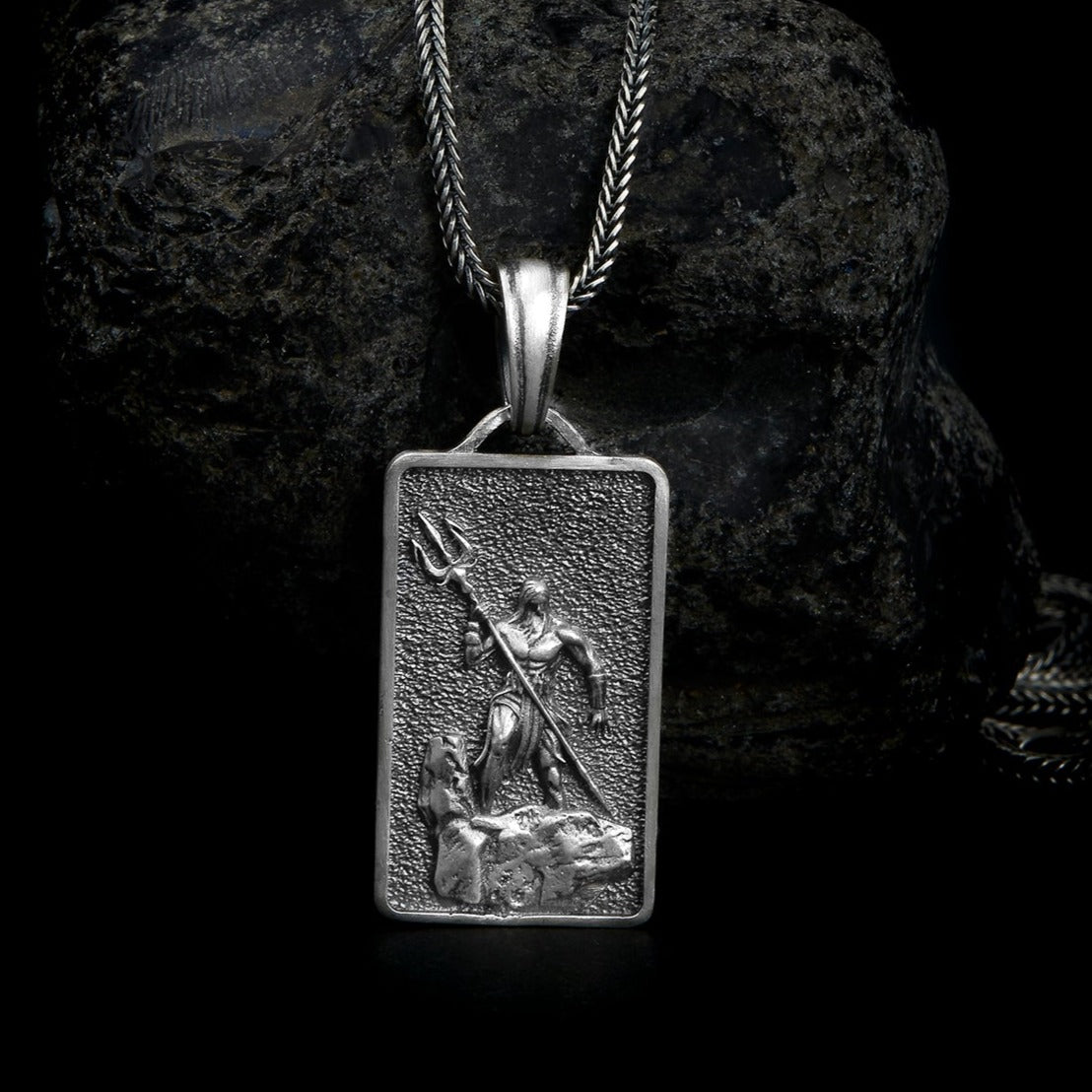 handmade sterling silver necklace featuring a detailed pendant of Poseidon, the Greek god of the sea, holding his iconic trident