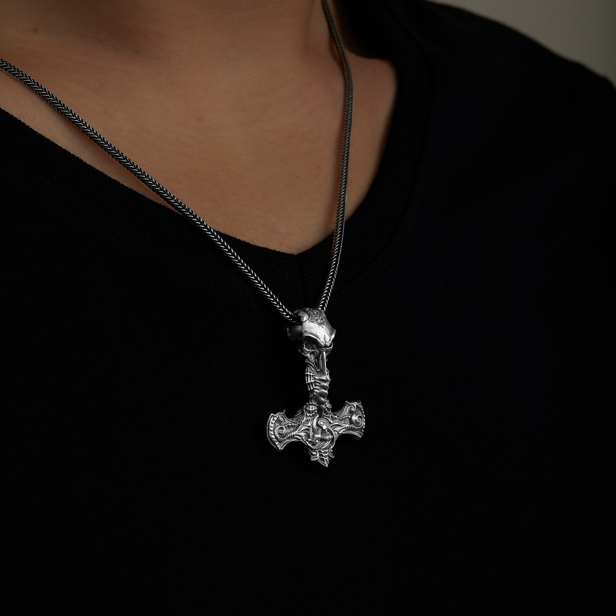 handmade sterling silver Thor Hammer Crow Necklace on the neck preview