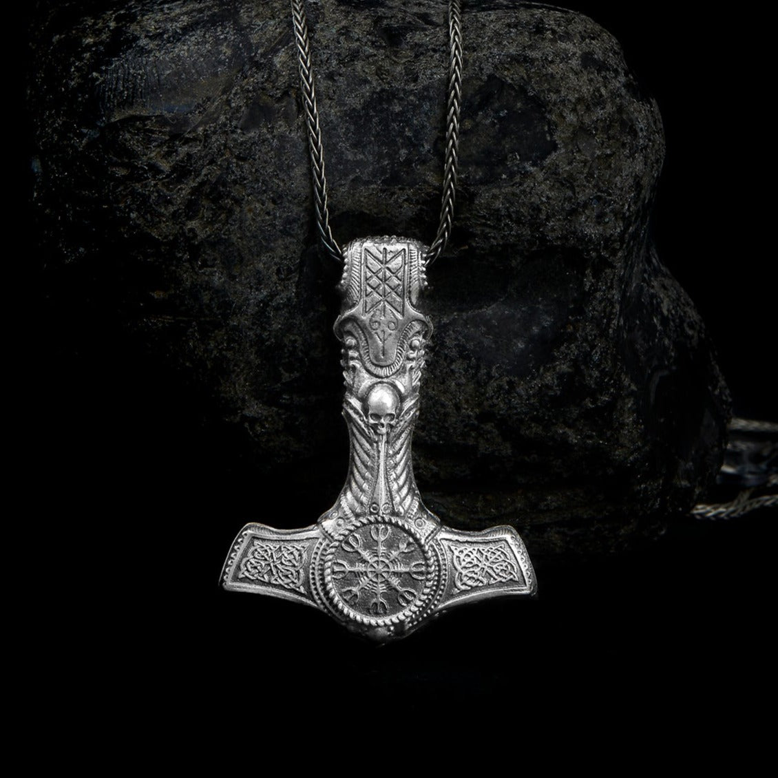 Close-up of a Sterling Silver Thor Hammer Necklace, reflecting Norse artistry and legend. Mjolnir Pendant, God of Thunder, Legendary weapon