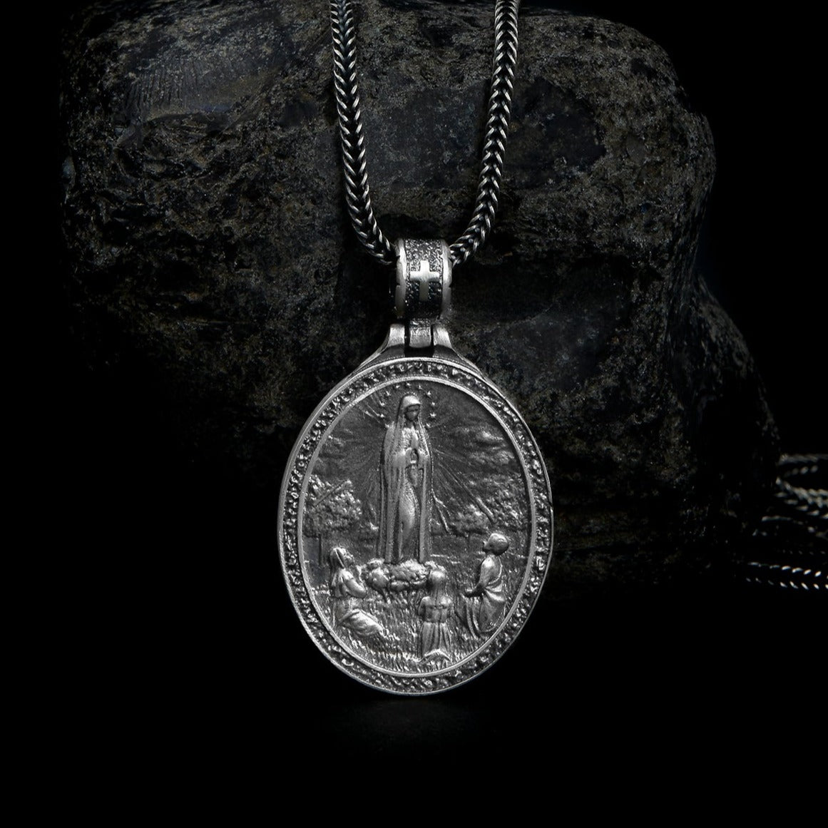  Detailed Sterling Silver Virgin Mary pendant hanging gracefully on a delicate chain, symbolizing purity and divine motherhood.