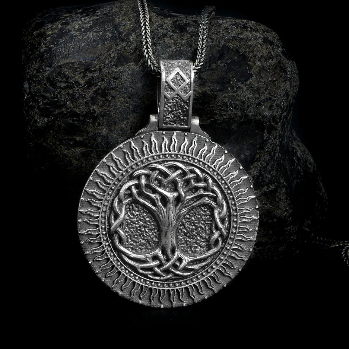 Sterling silver pendant necklace featuring the detailed Yggdrasil, the World Tree from Norse mythology, symbolizing life, interconnectedness, and cosmic balance.