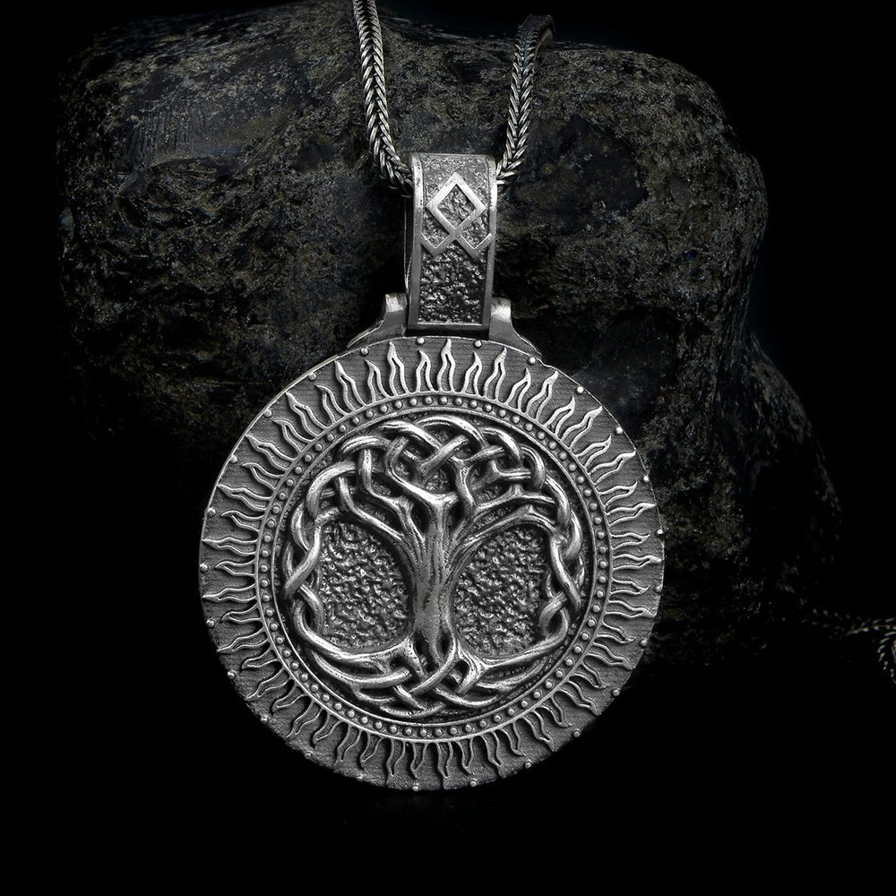 Sterling silver pendant necklace featuring the detailed Yggdrasil, the World Tree from Norse mythology, symbolizing life, interconnectedness, and cosmic balance.