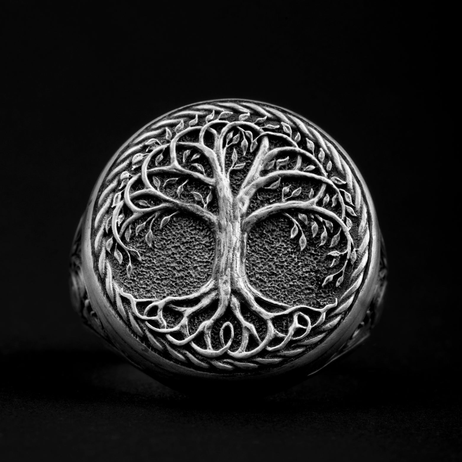 Detailed sterling silver men's ring showcasing the intricate Yggdrasil, the Tree of Life from Norse mythology, representing interconnectedness and the universe's vast expanse.