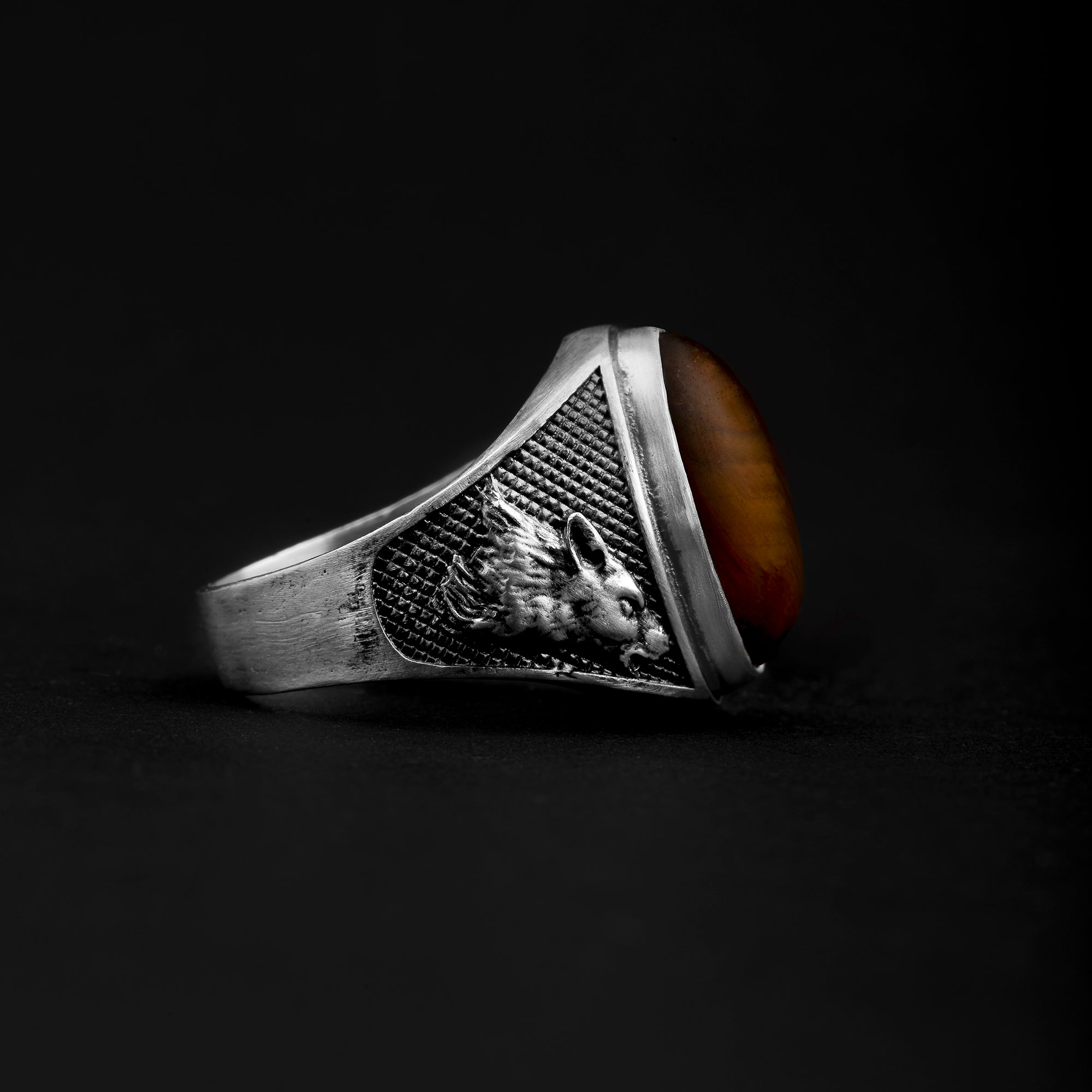 White and black silver ring with natural tiger's eye.
