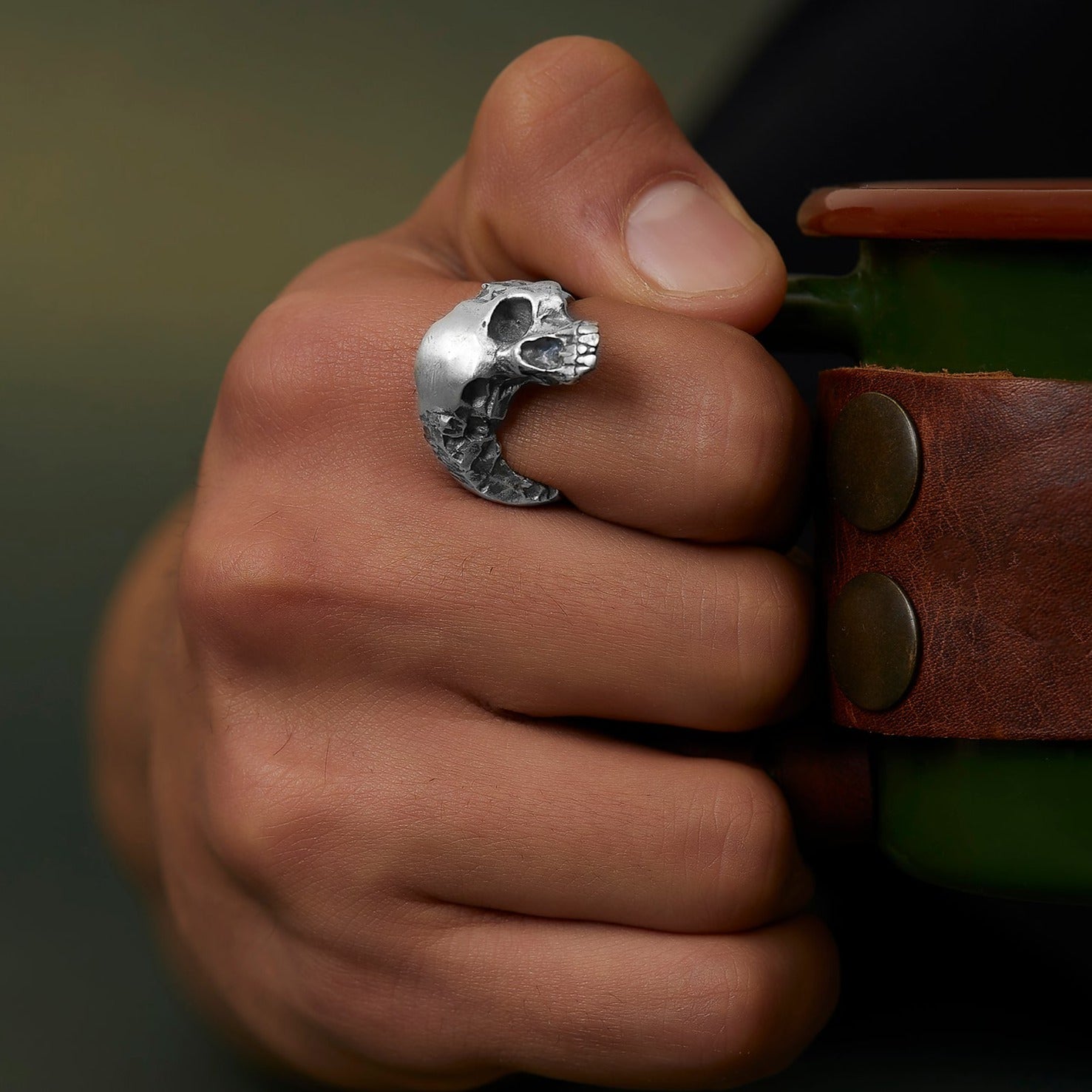 handmade sterling silver Wounded Skull Head Ring on the hand preview